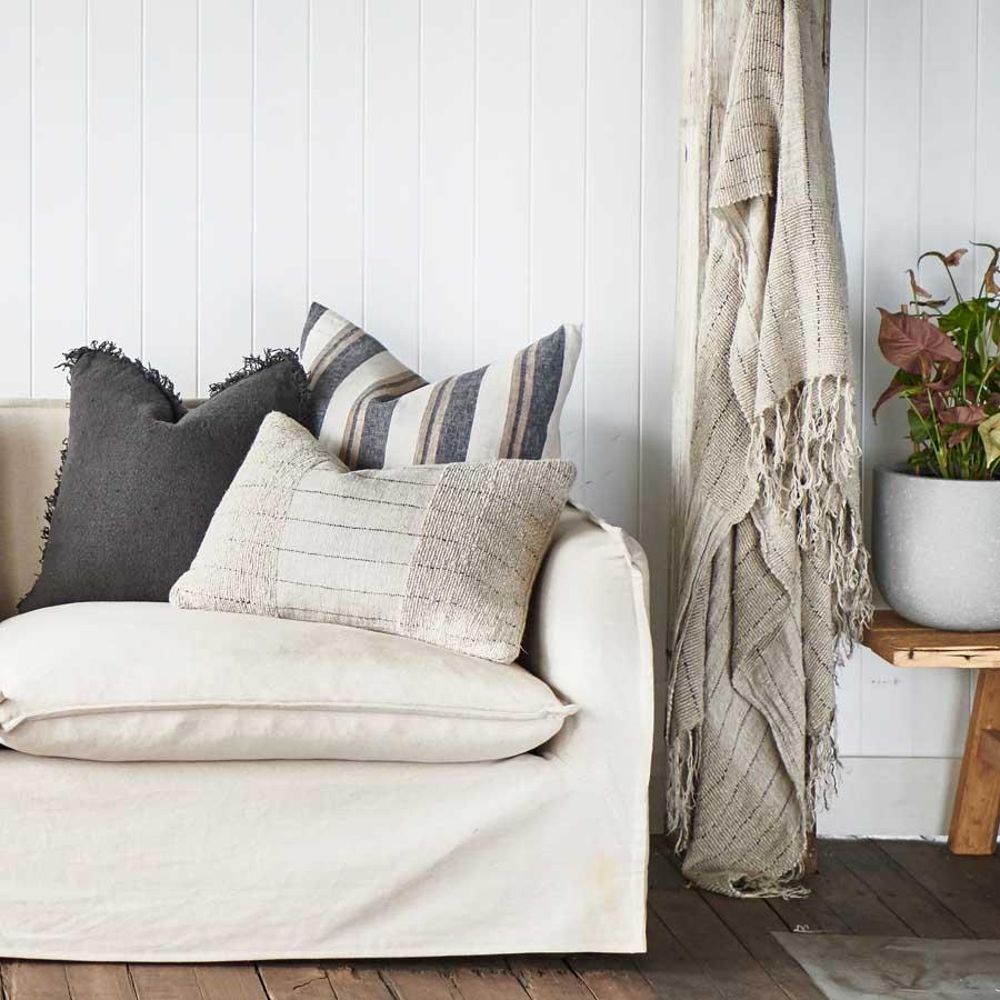 image of styled room with cushions and a throw 