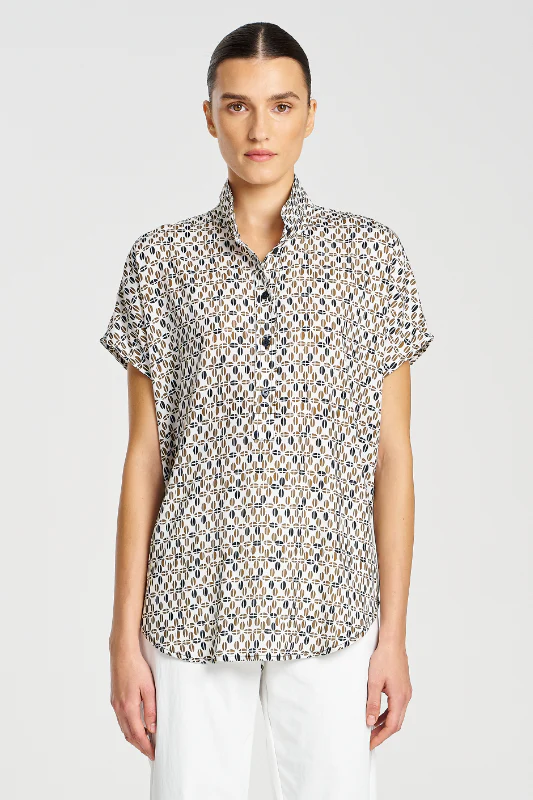 Woman wearing a patterned short-sleeve blouse on a white background