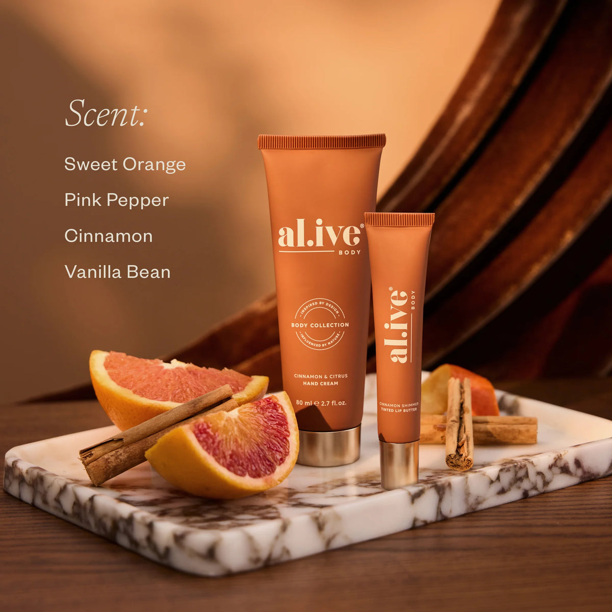 al.ive body Hand & Lip Set with scent notes of sweet orange, pink pepper, cinnamon and vanilla bean
