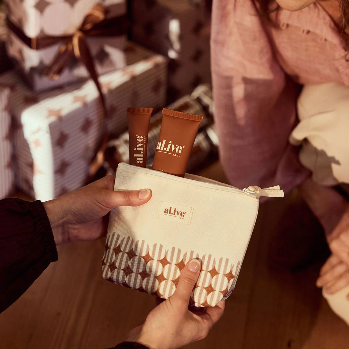 al.ive body Hand & Lip Set being unwrapped as a Christmas gift
