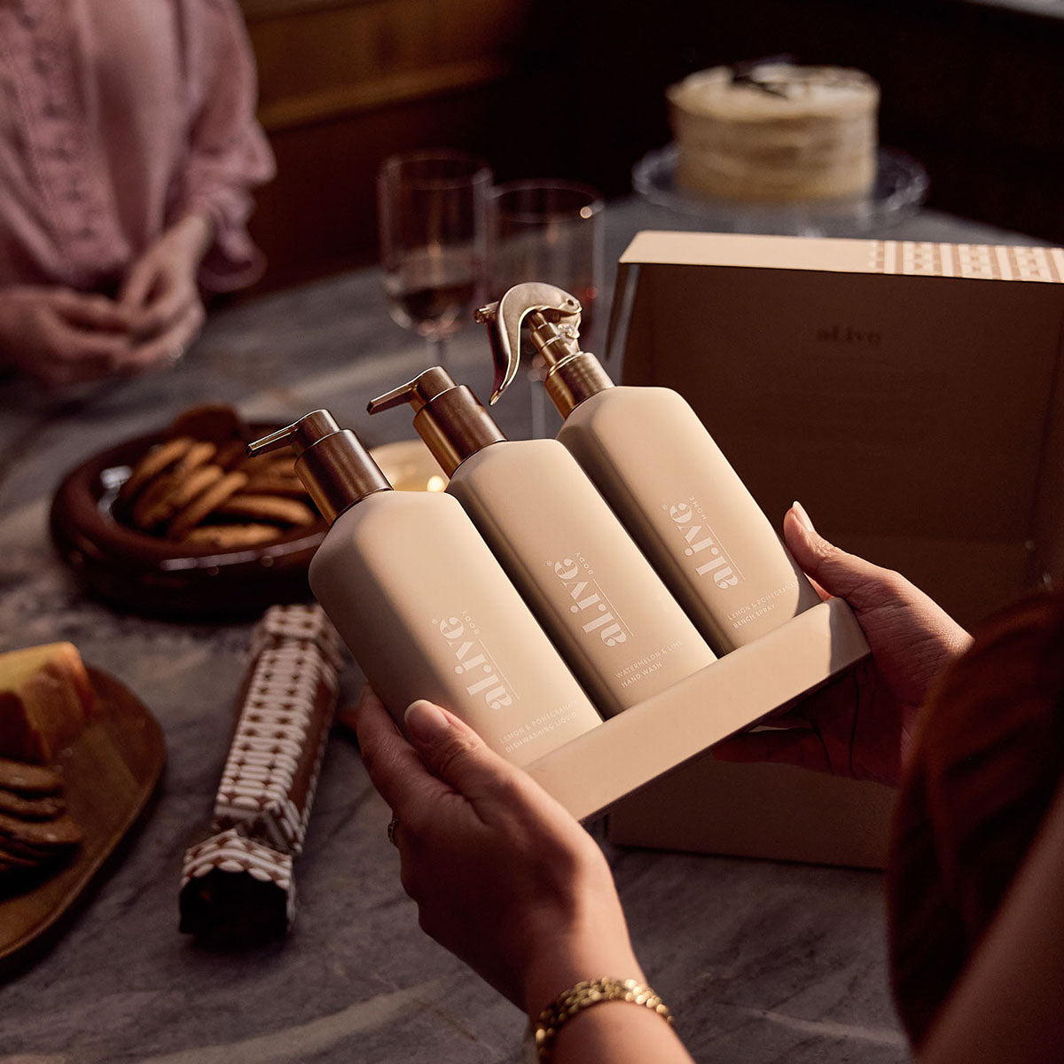 al.ive body Limited Edition Kitchen Trio Bronze Edition being unboxed as a Christmas gift at a festive table