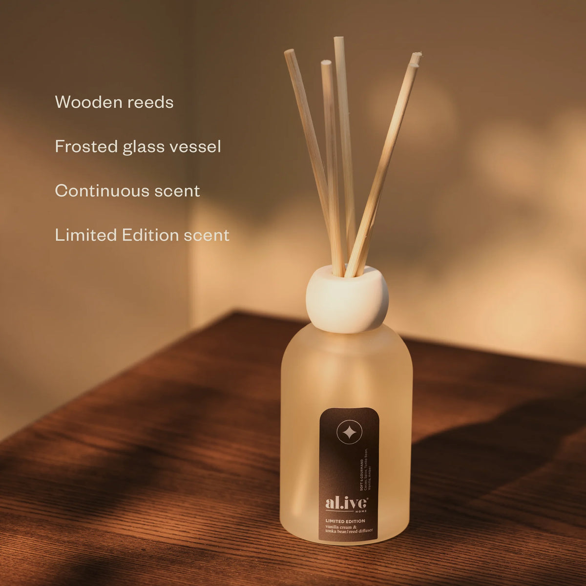 al.ive body Limited Edition Reed Diffuser with wooden reeds and frosted glass vessel for continuous scent
