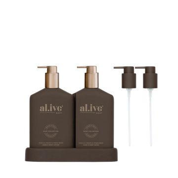 al.ive body Limited Edition Transformative Wash & Lotion Duo in Vanilla Cream & Tonka Bean, Chocolate bottles on matching tray with bronze pumps