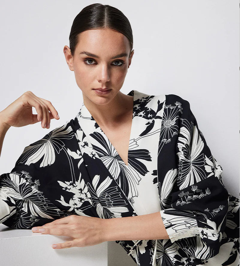 Cable Melbourne Spring 2026 campaign banner featuring the Rita Midi Dress in Deco Print and the Crepe Spring Cardigan in Black