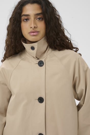 Haus of Alma InWear Hinonaiw Cape Jacket in Sandstone - cropped cape-back jacket with dolman sleeves, view 03