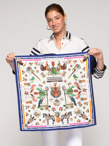 Vilagallo Jungle Disco Medium Silk Scarf held by model, tiger and disco ball tropical print