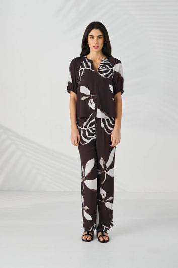 Full-length front view of the Lania Maple Pant in Maple Print styled as a co-ord