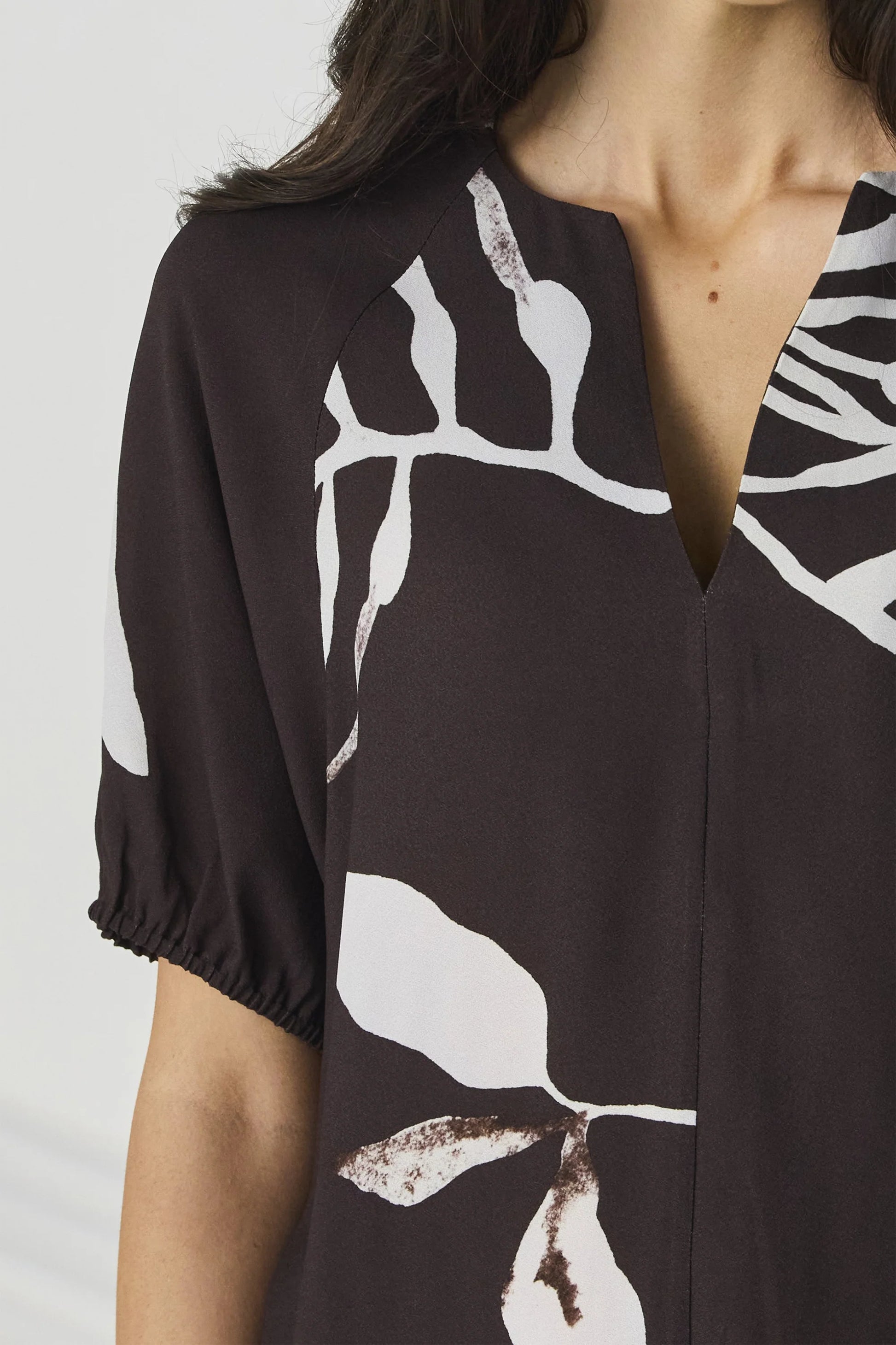 Detail of the elasticated raglan sleeve cuff on the Lania Maple Top in Maple Print