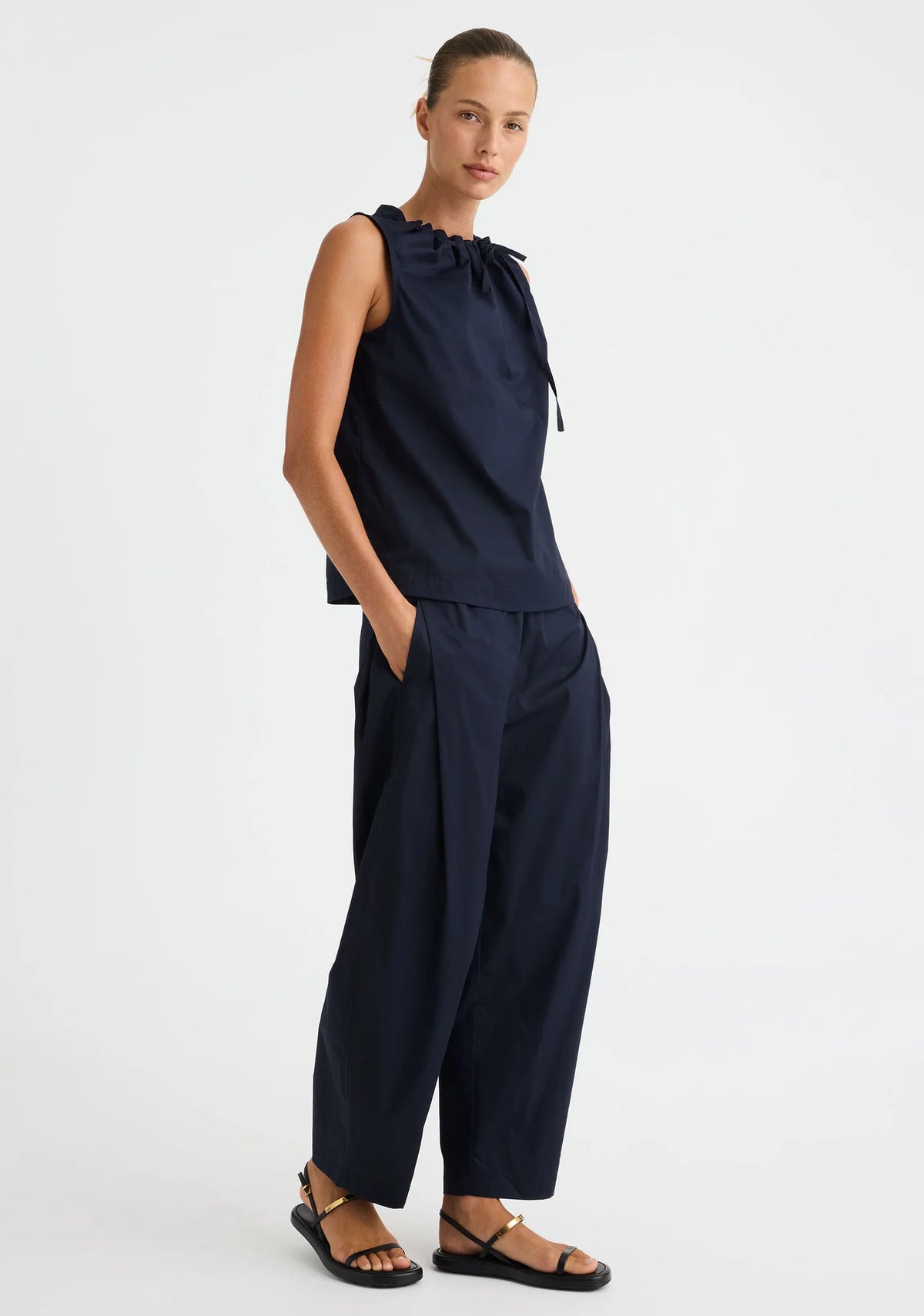 Morrison Maddison Tie Top in Navy, worn - full length, styled with navy pants