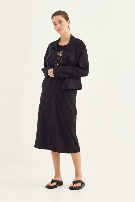 Verge Acrobat Porter Skirt in Black, worn - front styled with the Acrobat Icon Jacket